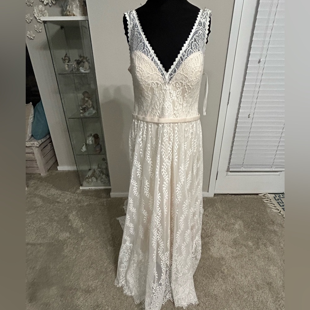 Allure ivory lace and champagne lining bridal gown